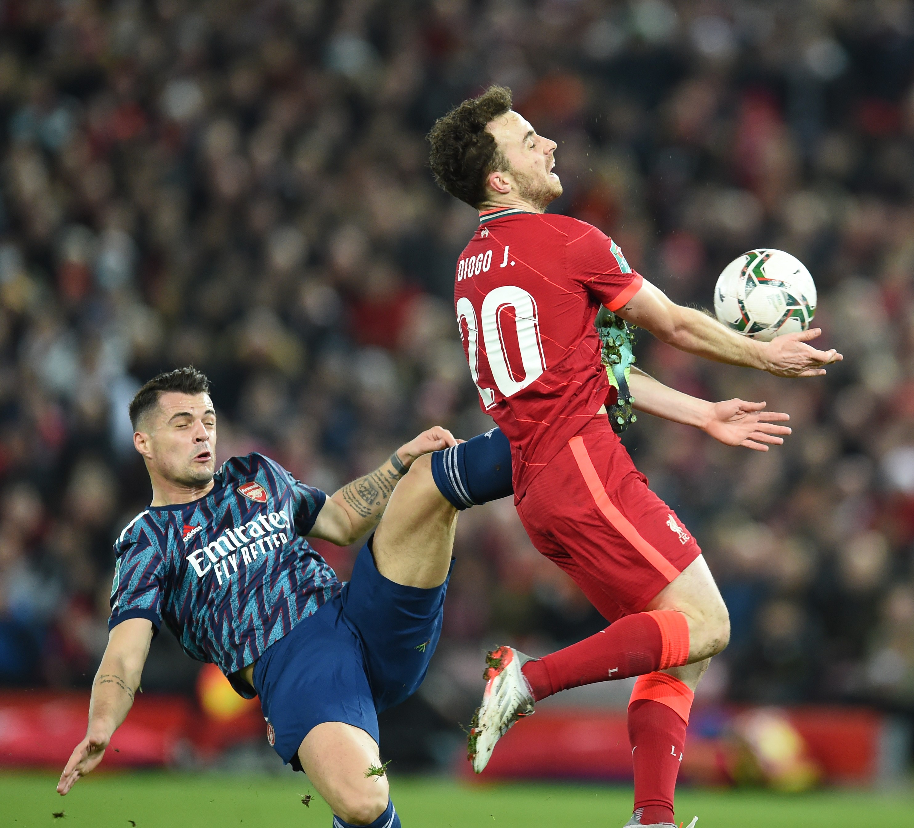 Arsenal's Granit Xhaka of Arsenal brings down Diogo Jota of Liverpool and gets sent off during the Carabao Cup Semi Final First Leg match between Liverpool and Arsenal at Anfield on January 13, 2022 in Liverpool, England