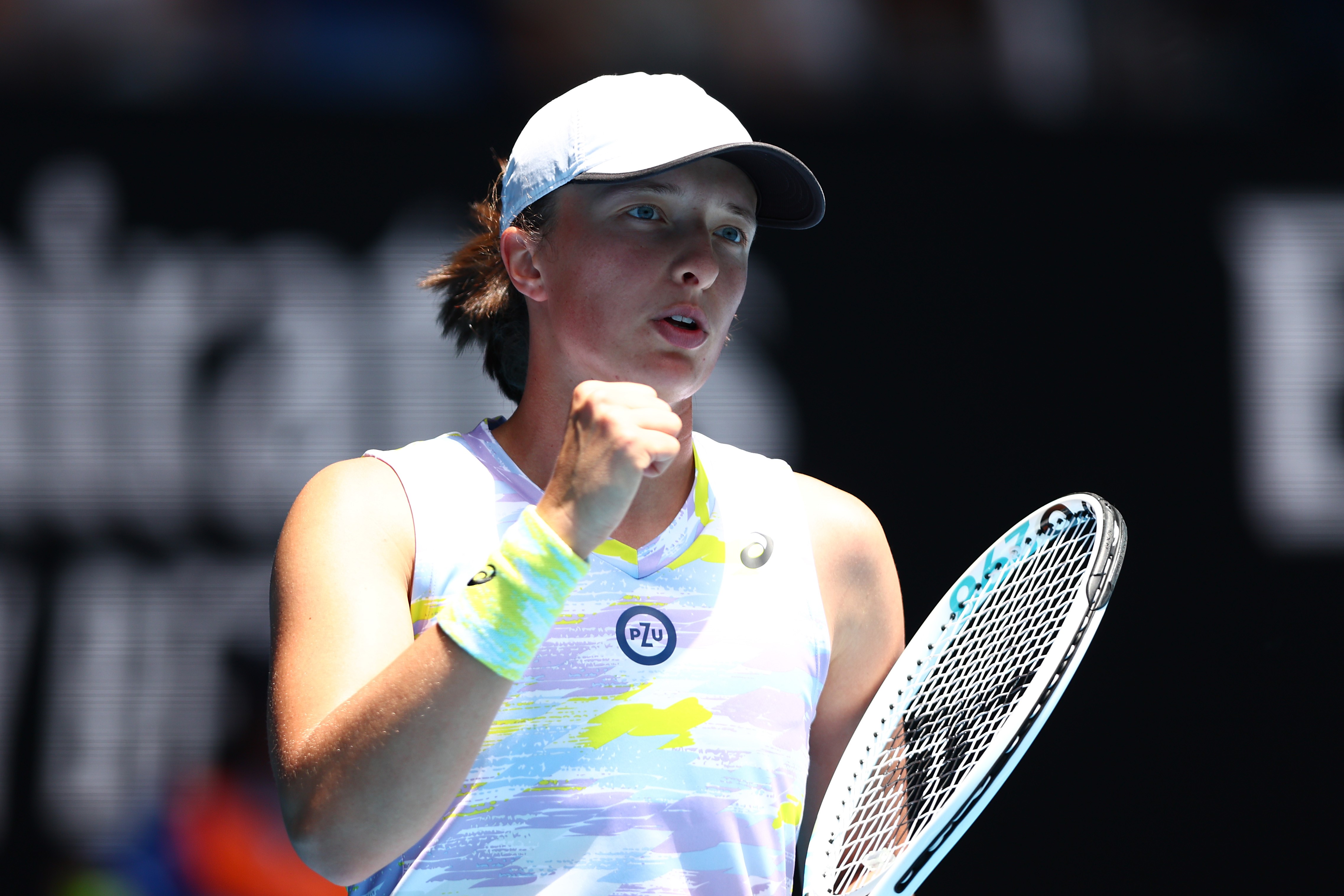 Iga Swiatek of Poland celebrates after winning a point in her first round singles match against Harriet Dart of Great Britain during day two of the 2022 Australian Open at Melbourne Park on January 18, 2022 in Melbourne, Australia. (Photo by Clive Brunski