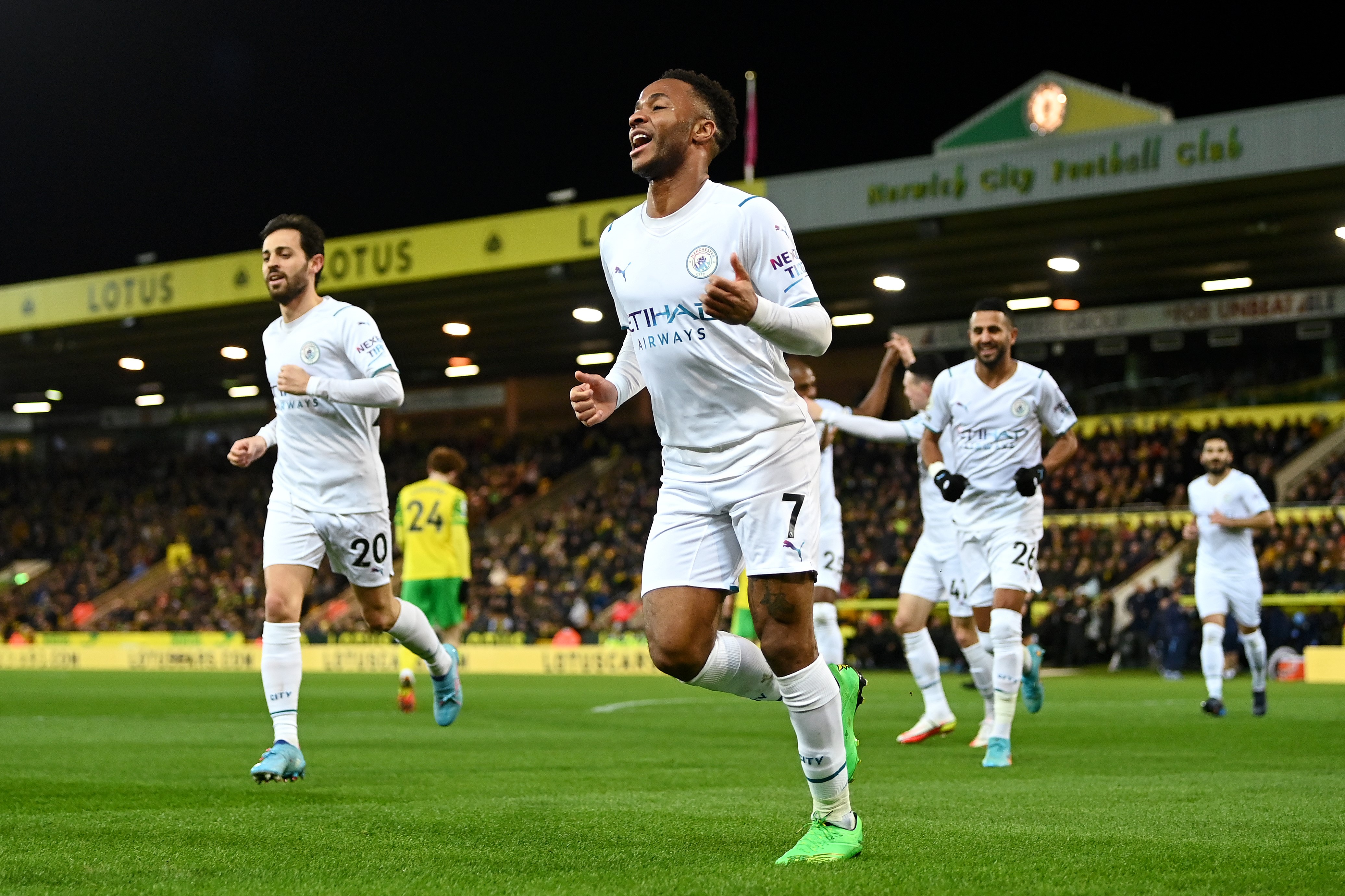 Raheem Sterling of Manchester City celebrates after scoring their side's first goal during the Premier League match between Norwich City and Manchester City at Carrow Road on February 12, 2022 in Norwich, England. (Photo by Shaun Botterill/Getty Images)