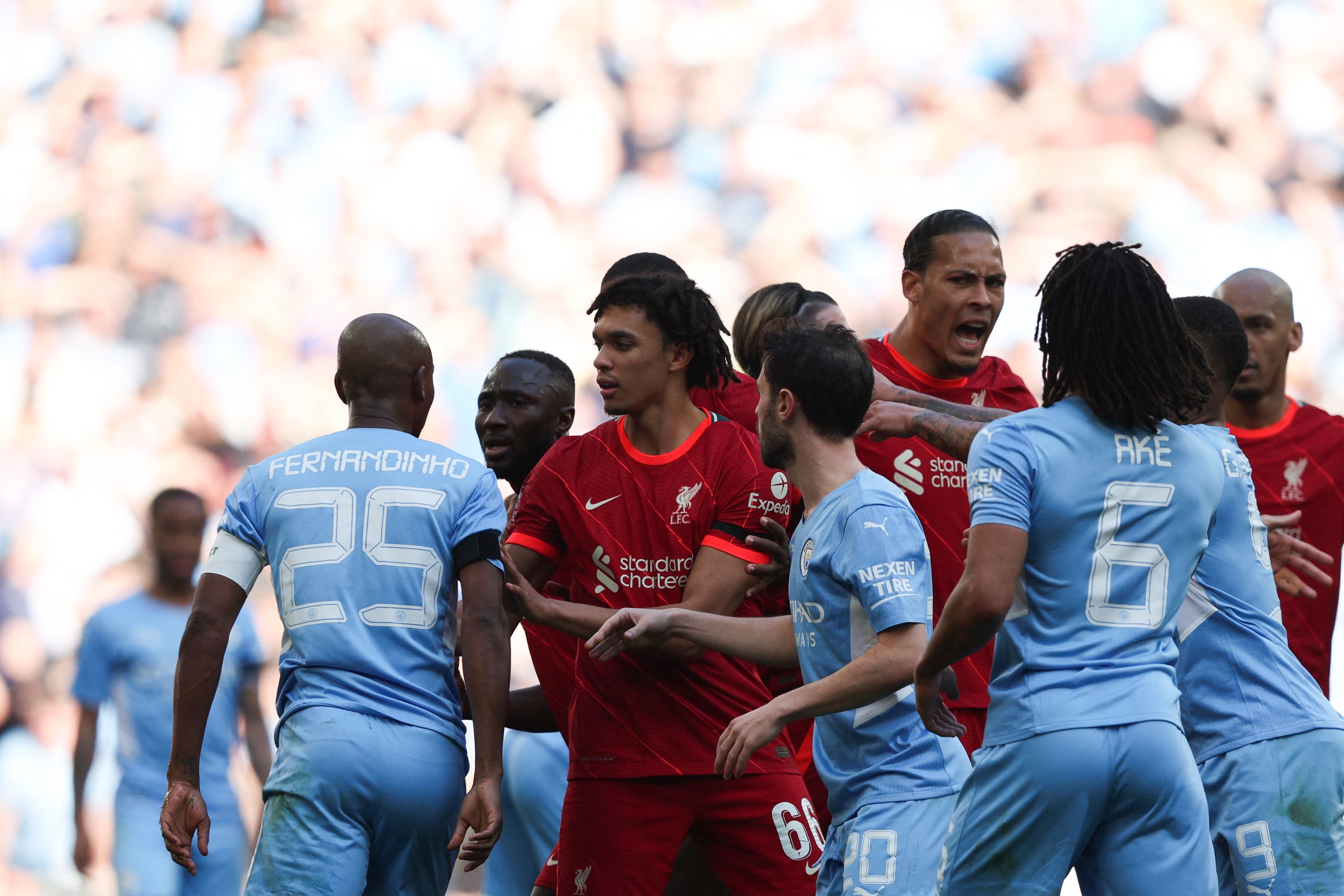 Manchester City and Liverpool's players argue following Manchester City's Brazilian midfielder Fernandinho's tackle on Liverpool's Senegalese striker Sadio Mane during the English FA Cup semi-final football match between Liverpool and Manchester City at W