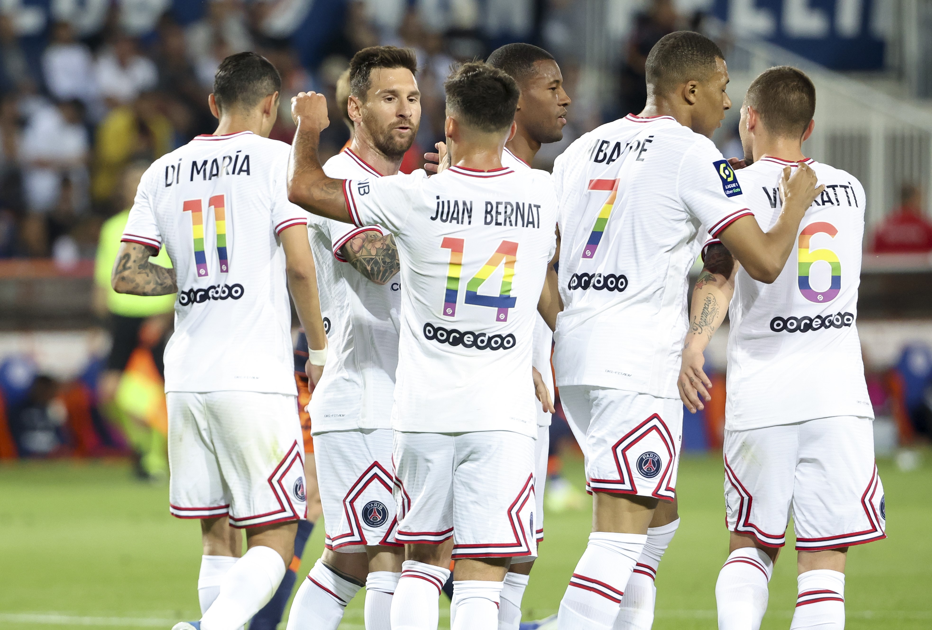 Lionel Messi of PSG celebrates his second goal with Juan Bernat and teammates during the Ligue 1 Uber Eats match between Montpellier HSC (MHSC) and Paris Saint Germain (PSG) at Stade de la Mosson on May 14, 2022 in Montpellier, France.