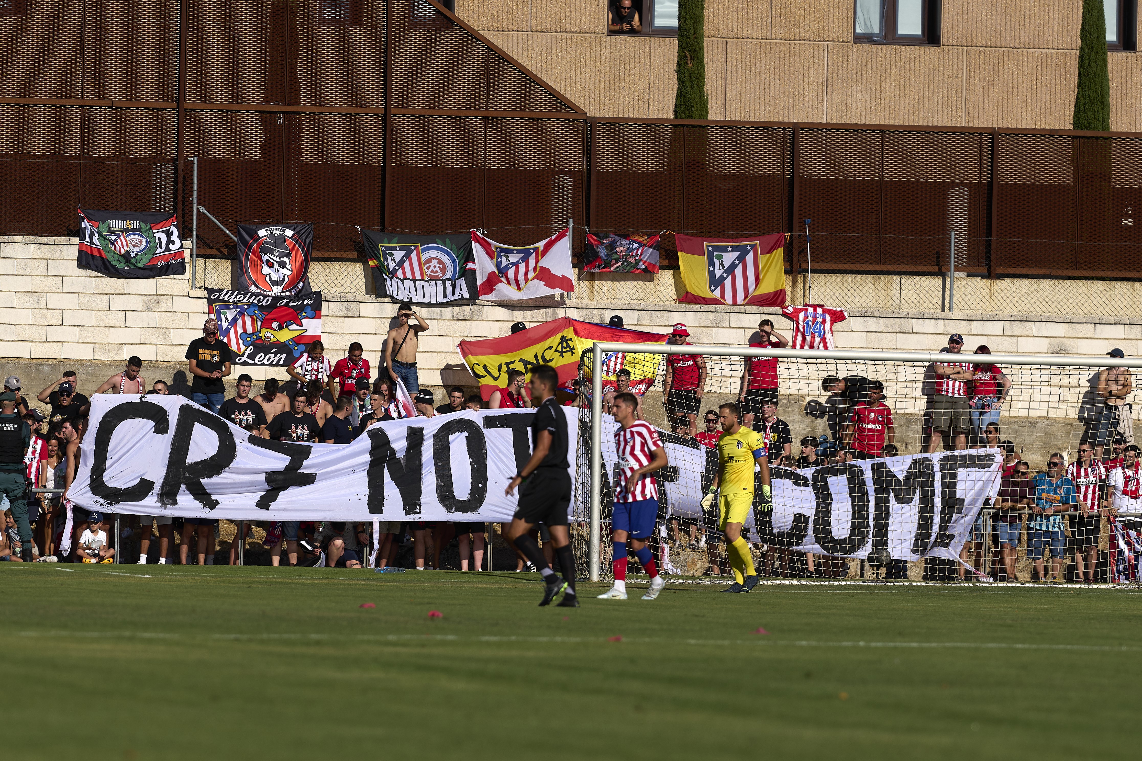 Fans of Atletico de Madrid display a sign against Cristiano Ronaldo during the pre-season friendly match between Numancia and Atletico de Madrid