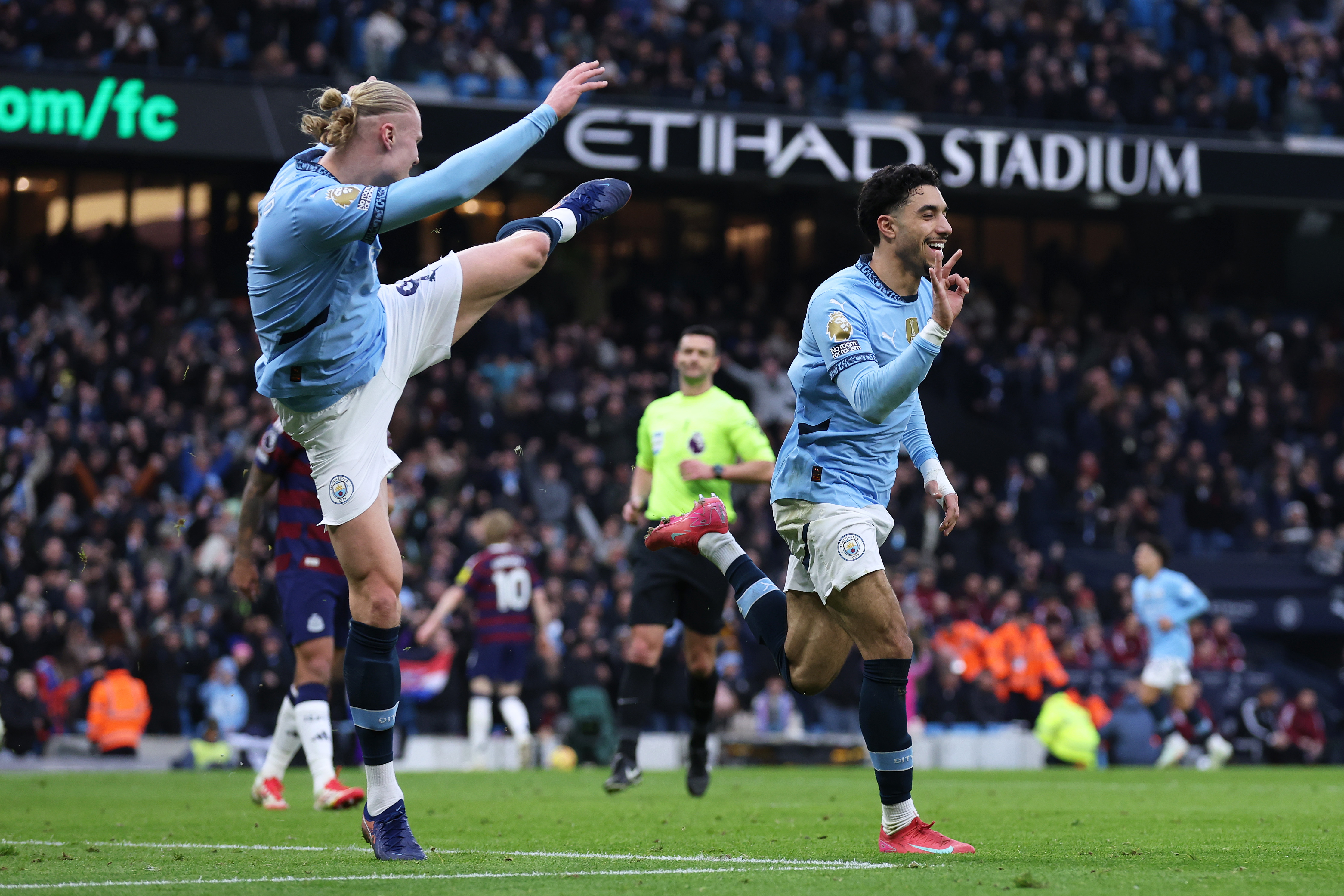 Erling Haaland and Omar Marmash celebrate Man City.