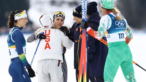 Watch: Heartwarming scenes as final cross-country skiing finisher mobbed by fellow competitors