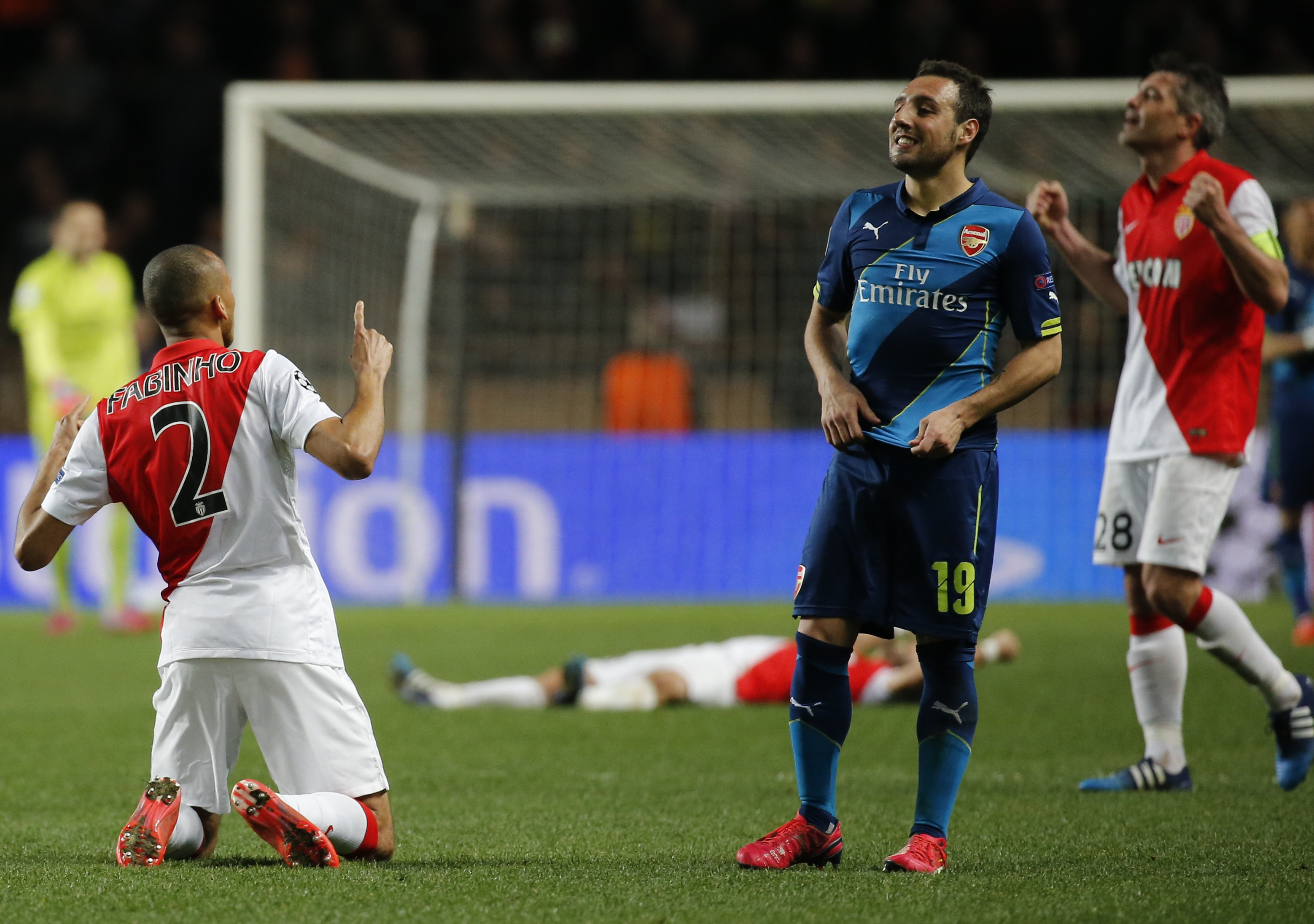 AS Monaco's Fabinho (L) and Jeremy Toulalan (R) celebrate their qualification near Arsenal's Santi Cazorla.