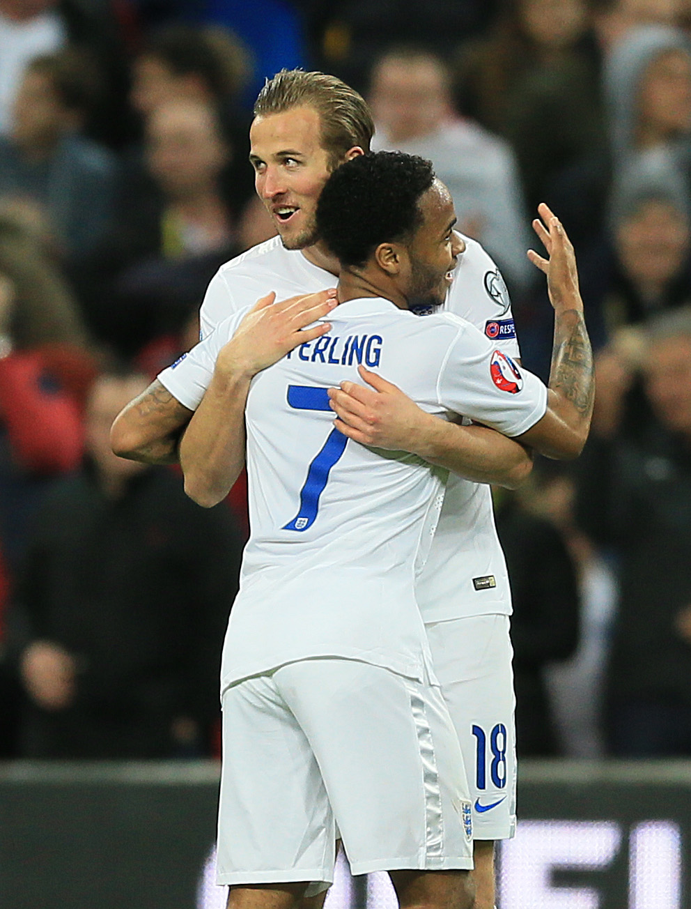 Harry Kane and Raheem Sterling celebrate England's fourth goal in the 4-0 win over Lithuania.