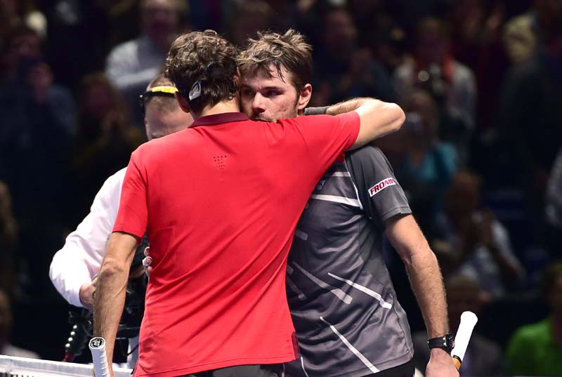 Roger Federer embraces Stan Wawrinka