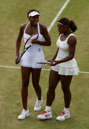 USA's Venus Williams (left) and Serena Williams (right) during their match against Slovakia's Dominika Cibulkova and Russia's Anastasia Pavlyuchenkova