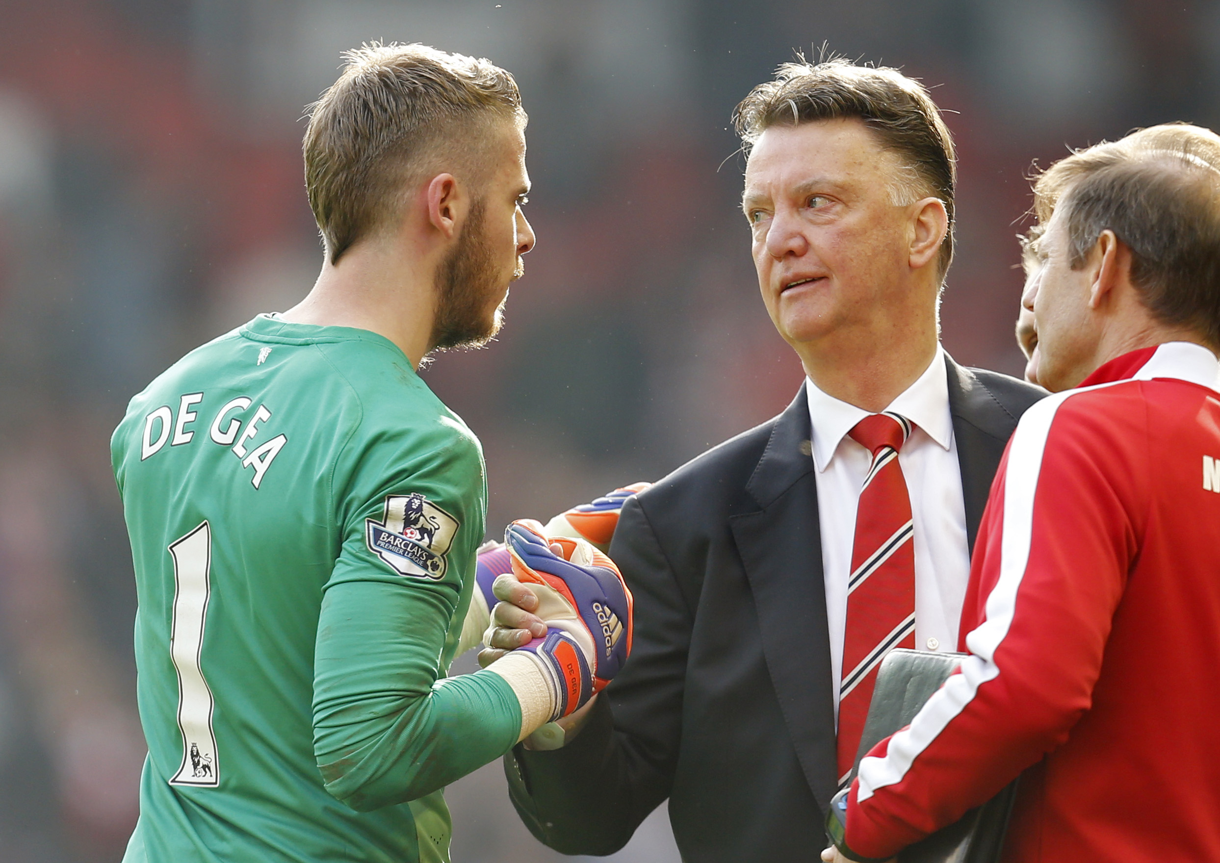 Manchester United manager Louis van Gaal celebrates with David De Gea at full time of the win over Liverpool