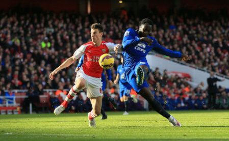 Everton's Romelu Lukaku has a shot on goal under pressure from Arsenal's Laurent Koscielny (left)